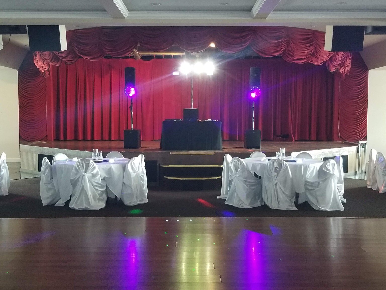 M-n-M Entertainment setup on a ballroom stage