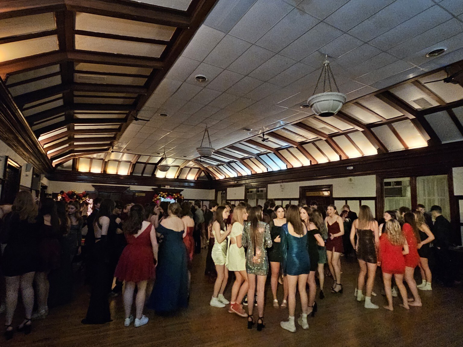 A large crowd filling the dance floor at a formal celebration